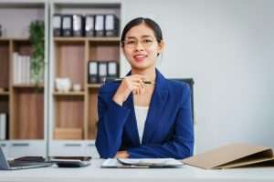 Asian businesswoman specializing in stock market financial services, including roles loan officer