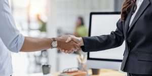 Business man offer and give hand for handshake in office. Successful job interview. Apply for loan