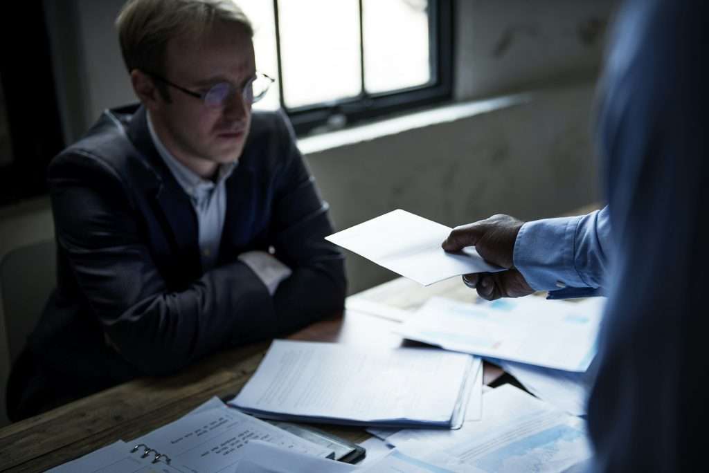 Businessman being served a lawsuit