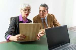 Consultant and Client Reviewing Contract - Detailed Verification