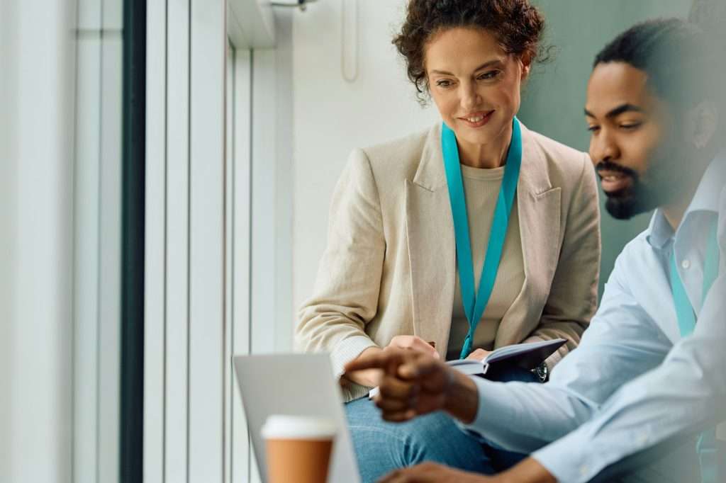 Corporate managers using laptop while working in the office.