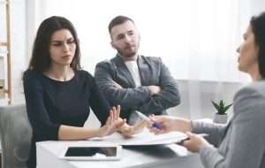 Deceived couple disputing about mortgage loan with realtor