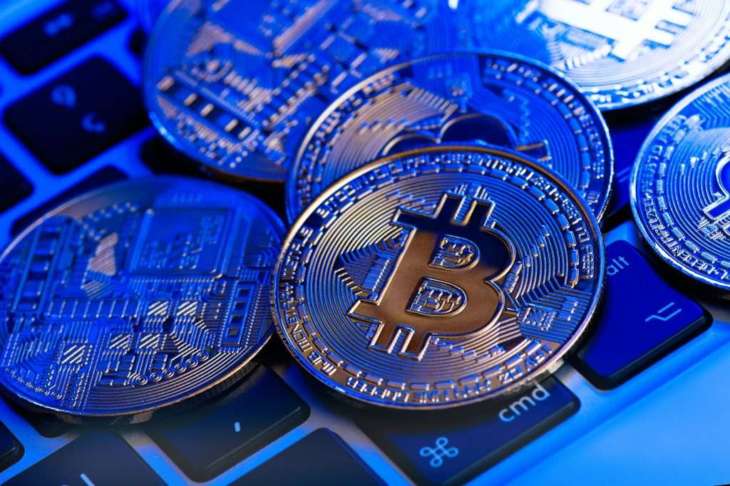 Golden bitcoin on keyboard computer. Business, money, cryptocurrency.
