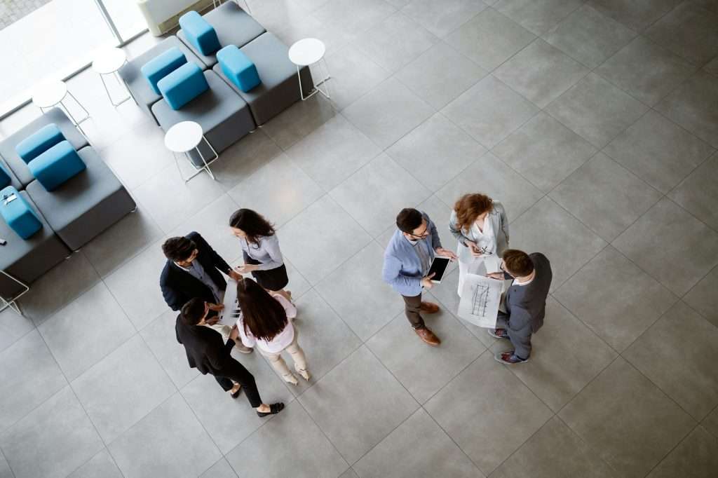 Group of lawyers discussing contract together in office