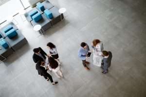 Group of lawyers discussing contract together in office