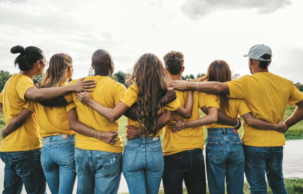 Group of people hugging together