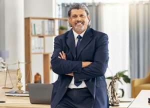 Portrait, lawyer and arms folded with smile man in office for legal advice at law firm. Attorney,