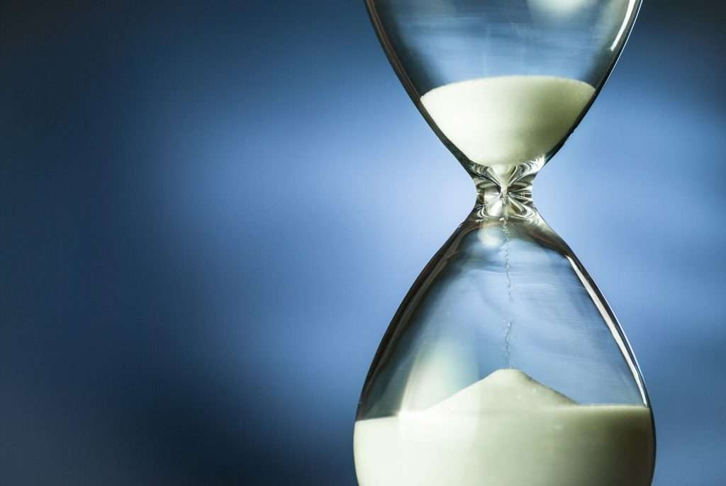 Sand running through an hourglass or egg timer