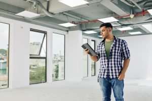 Contractor reading report on tablet