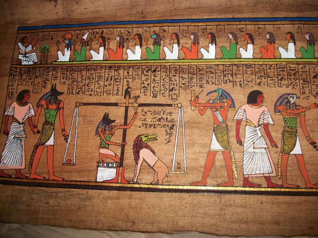 Egyptian hieroglyphics featuring Anubis representing the concept of judgment and justice in Ontario enforcement law