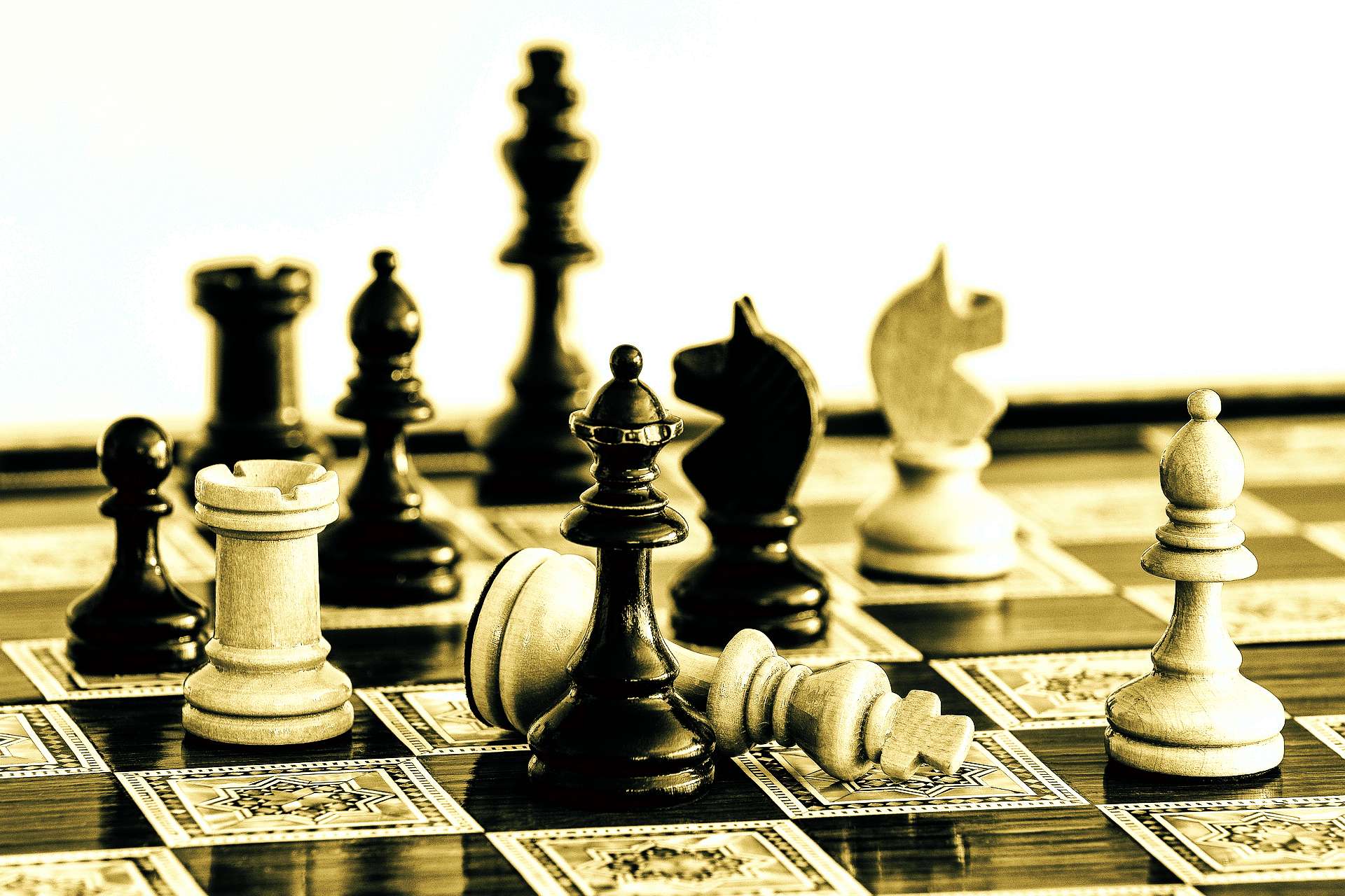 A chessboard representing the strategic complexity and litigation risks involved in mergers and acquisitions in Canada