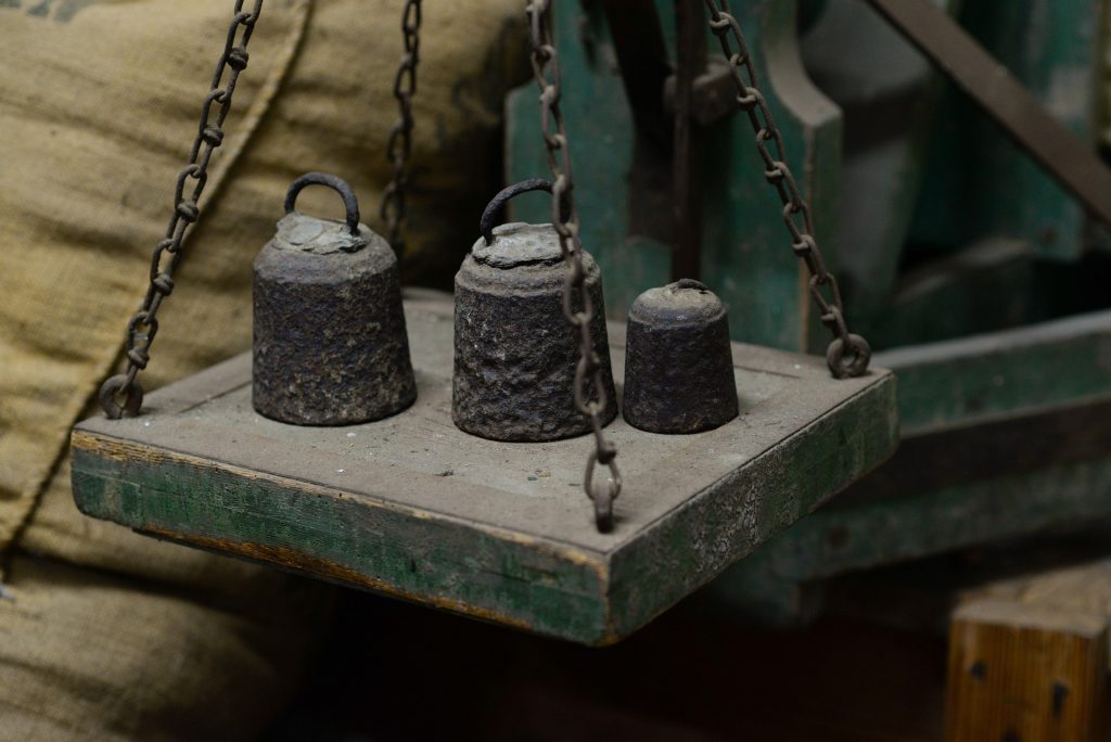 Three weights on a balance scale, representing the careful weighing of competing interests that lies at the heart of the doctrine of equity in Canadian law